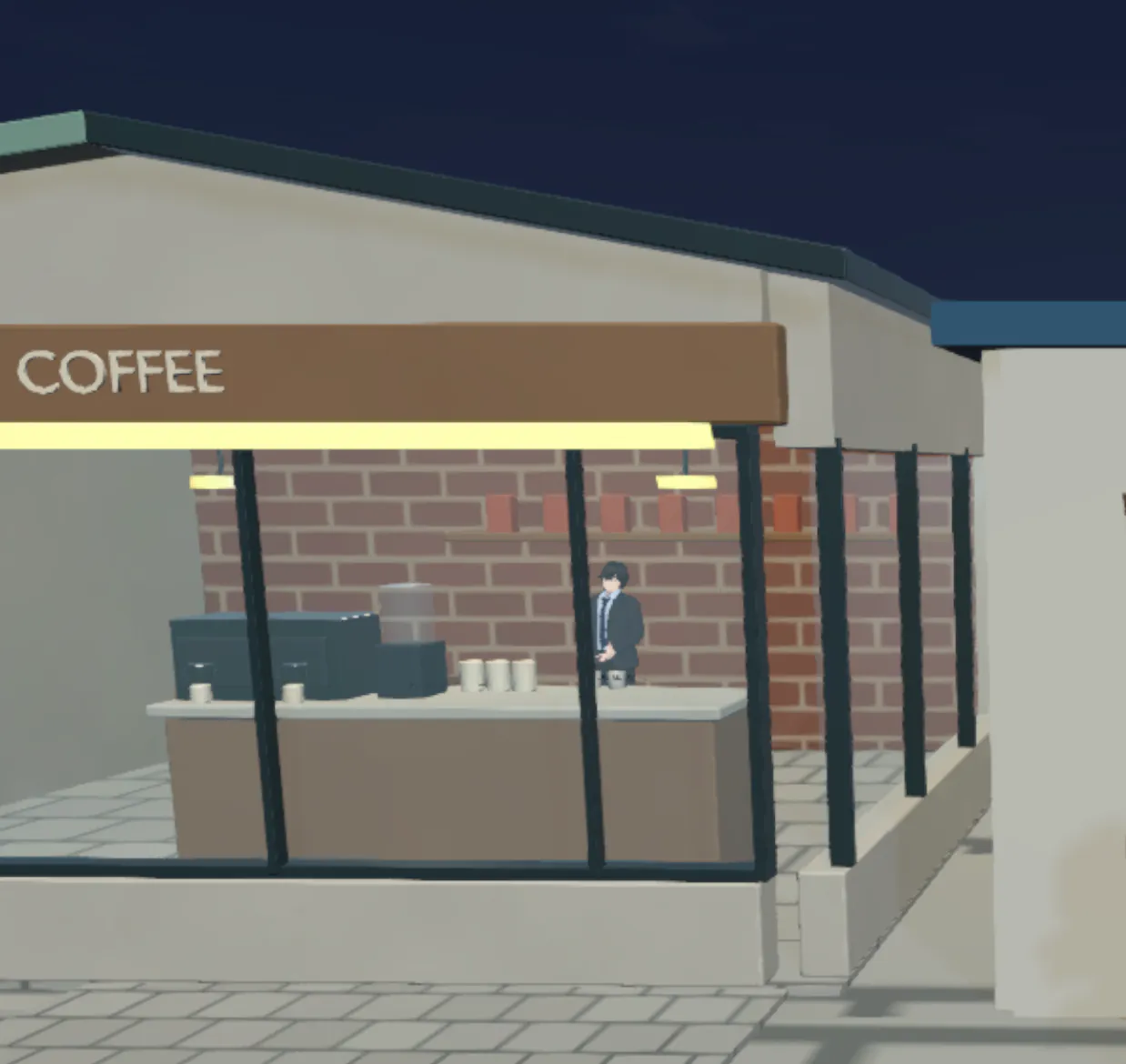 COFFEE 간판을 단 동네 카페. 유리창 너머로 직원이 일하고 있다.